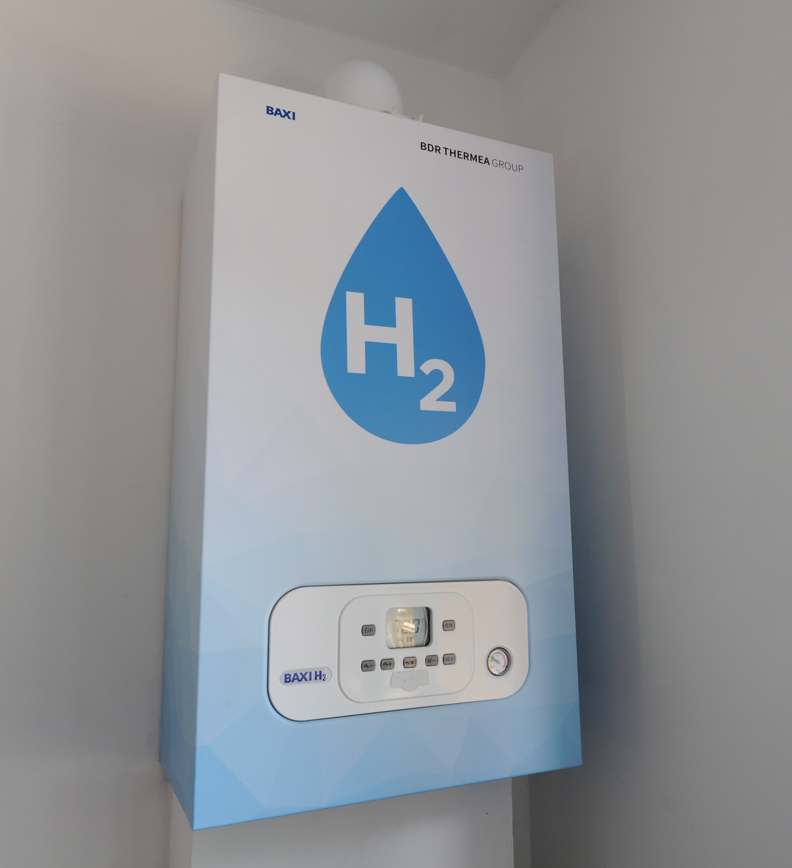 A household boiler with a blue water droplet on its facia, with "H2" in white text inside it.
