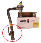 Image of an ECV (Emergency Control Valve). This is usually a red plastic or metallic handle which isolates the supply of gas to your meter and beyond. The ECV is highlighted by a red circle.