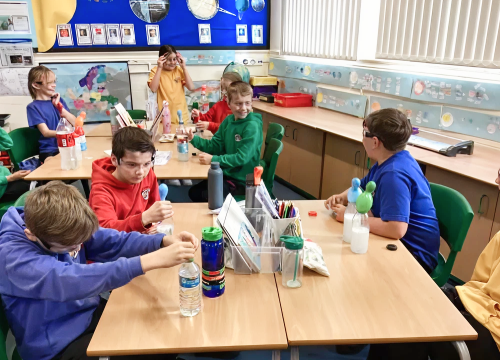 Kids in classroom learning about Net Zero
