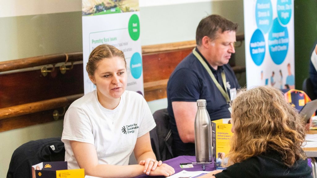 Image of woman from Centre for Sustainable Energy offering support and advice.